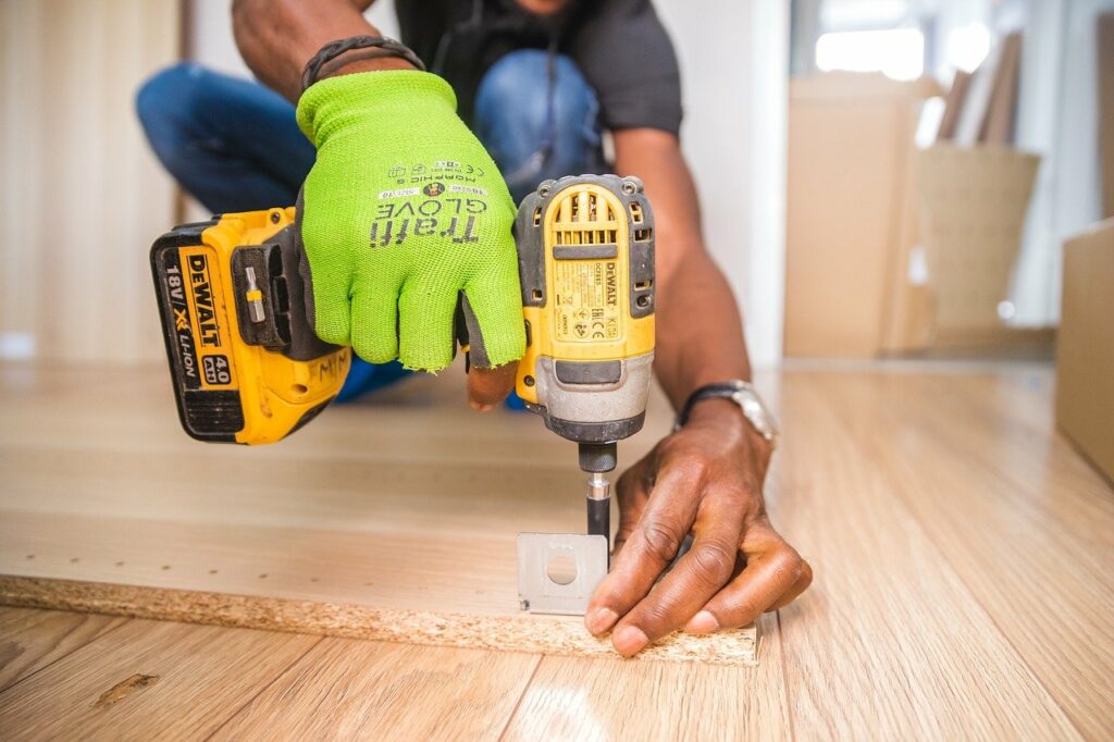 A man drilling into wood