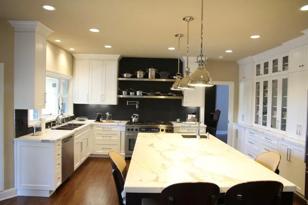 kitchen with extended island for more seating and built in China cabinet