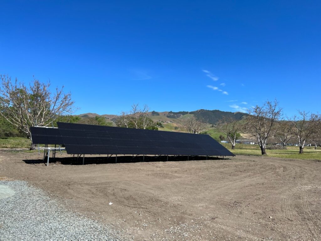 Portable solar panels in a field by Cal Sun Energy